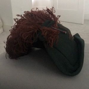 Green vintage hat with elaborate feather